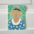 Postkarte "Frau mit Gänseblümchen" – Ansicht 1